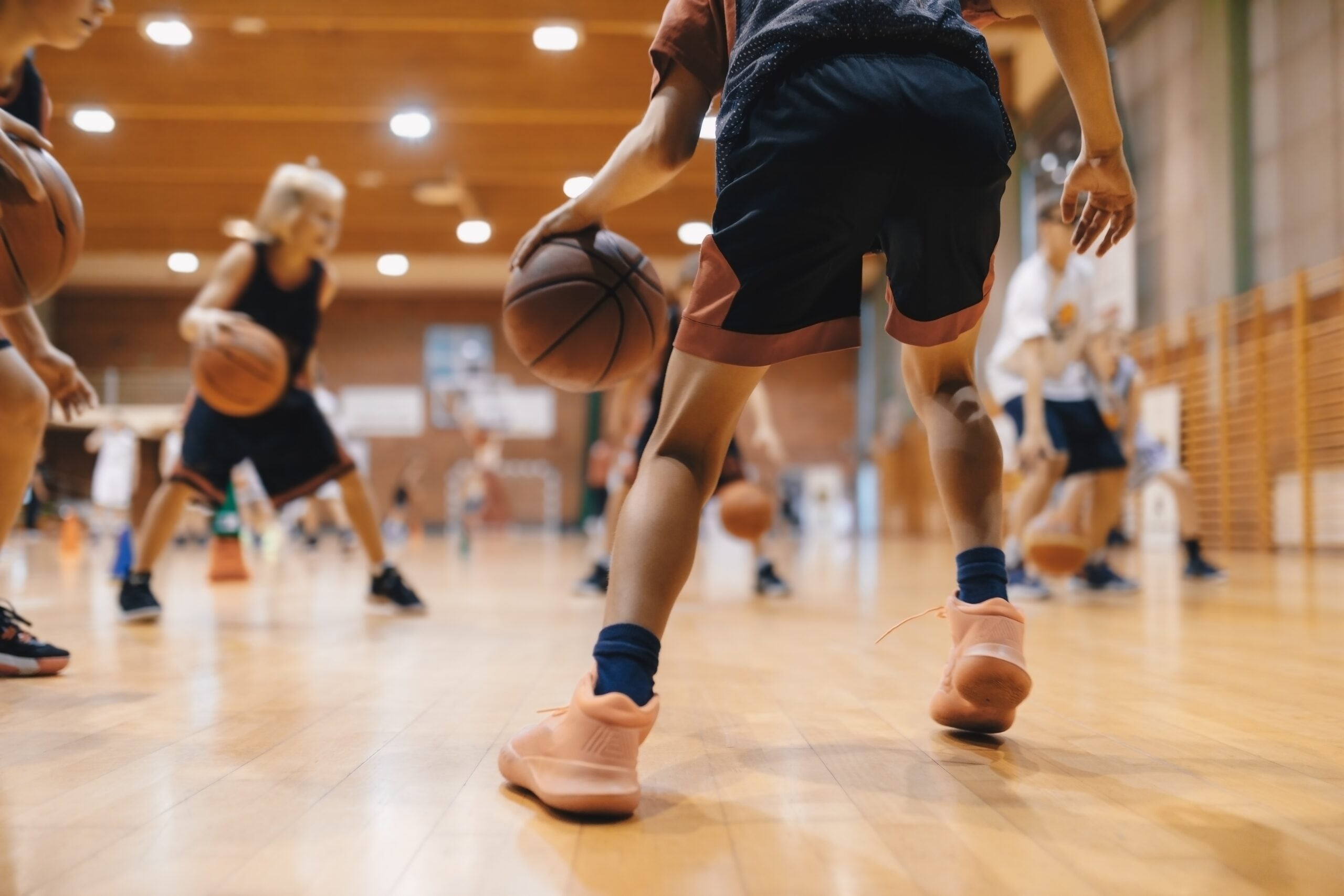 Junior players dribbling during academy training